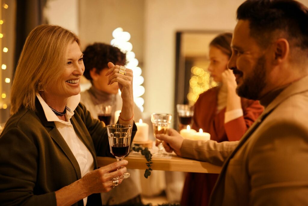 Co-workers mingling at a holiday party.