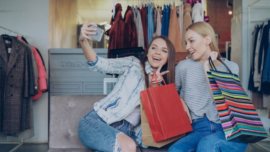Two women taking a selfie while shopping.