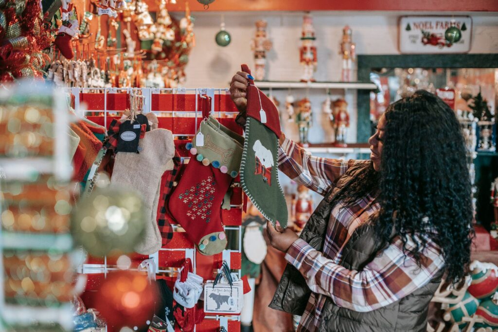 Woman shopping for stockings at a holiday market
