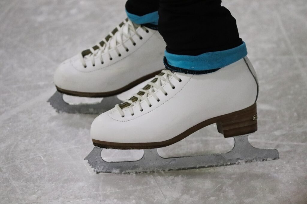 close up of white ice skates